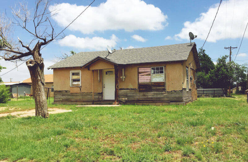 Boarded up house seen in Post, Texas